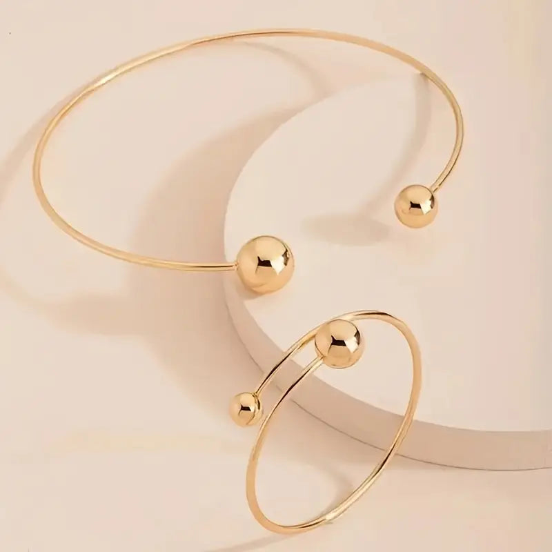 Glow™ Gold Armbandset von Rose & Oliver, elegante Armbänder aus goldenem Metall mit glänzenden Details.