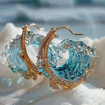 Brincos Ocean's Oath de Rose & Oliver, con diseño elegante, detalles en plata y acabado brillante, accesorios modernos y sofisticados.
